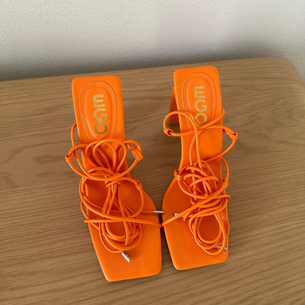 Only worn once. EGO brand orange summer heels size US 8. Trendy tie up heels
